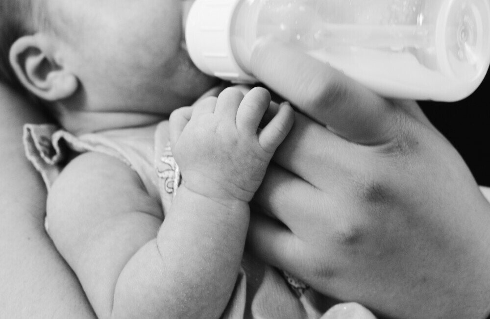 bottle feeding a baby